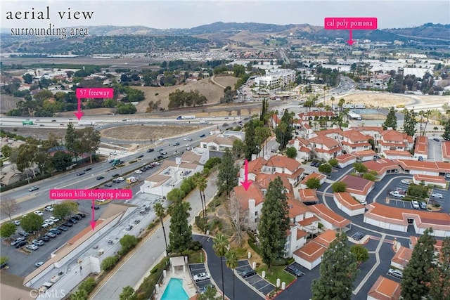 birds eye view of property with a mountain view