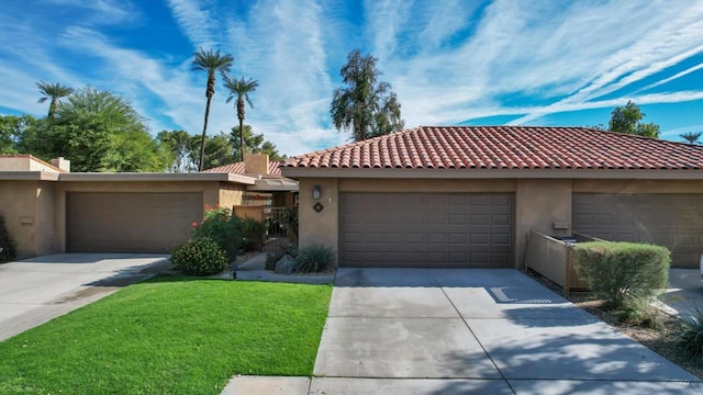 view of front facade with a garage and a front lawn