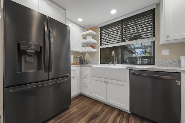 kitchen with white cabinetry, stainless steel fridge, and dishwasher