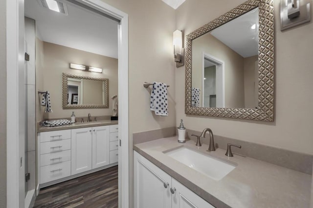 bathroom featuring vanity and hardwood / wood-style flooring