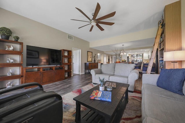 living room with ceiling fan and dark hardwood / wood-style flooring