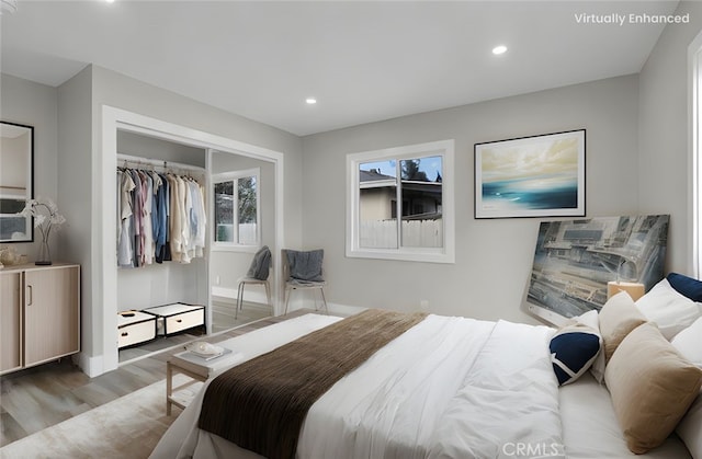 bedroom featuring hardwood / wood-style flooring and a closet