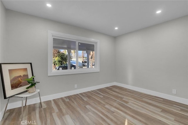 spare room featuring light hardwood / wood-style flooring