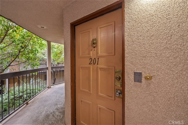 property entrance with a balcony