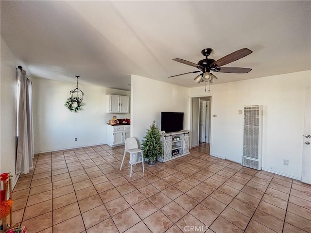 unfurnished living room featuring ceiling fan