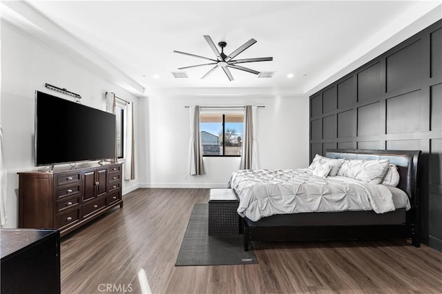 bedroom featuring ceiling fan and dark hardwood / wood-style flooring