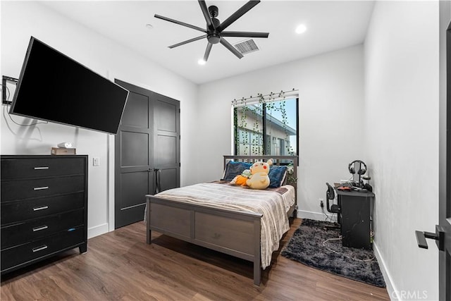 bedroom featuring wood-type flooring and ceiling fan