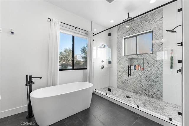 bathroom featuring shower with separate bathtub and tile patterned flooring