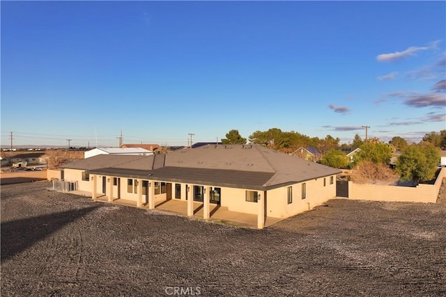 back of property featuring a patio area