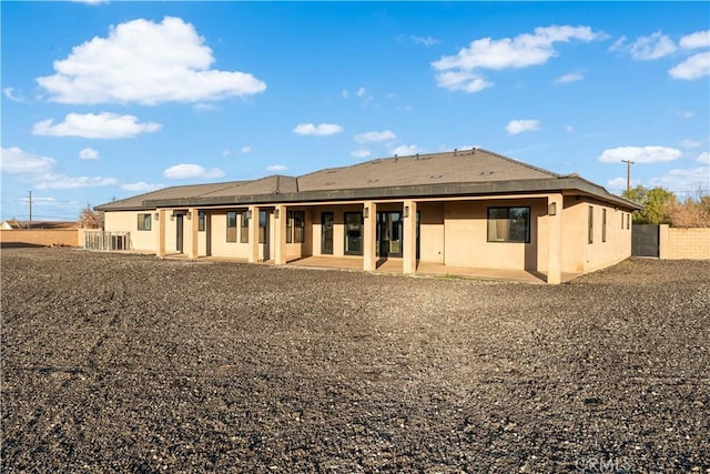 back of property featuring a patio