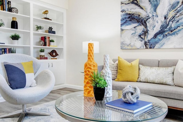 sitting room with hardwood / wood-style flooring