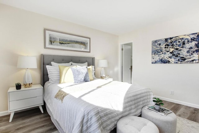 bedroom with hardwood / wood-style flooring