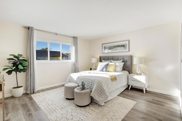 bedroom with hardwood / wood-style floors