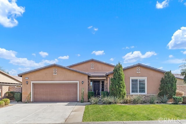 ranch-style home featuring a garage and a front lawn