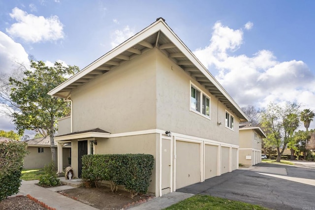 view of property exterior with a garage