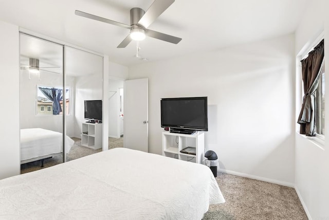 carpeted bedroom with a closet and ceiling fan