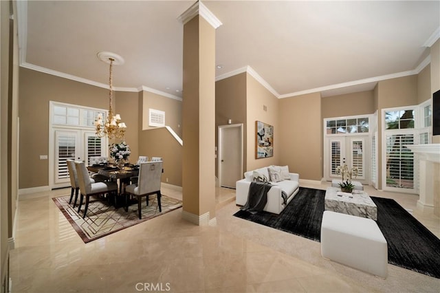 living room with french doors, ornamental molding, a high ceiling, and a notable chandelier