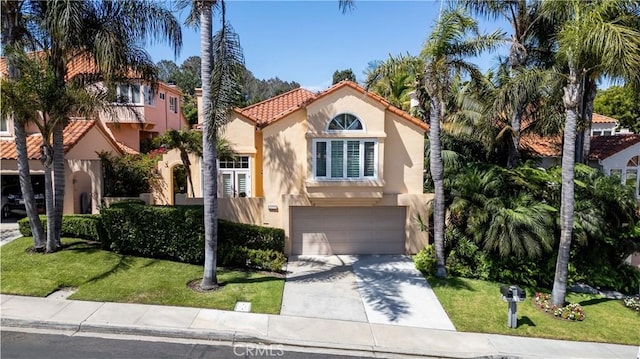 12999 Caminito Pointe Del Mar, Del Mar, CA 92014 - mediterranean / spanish-style house with stucco siding, a tiled roof, driveway, an attached garage, and a front yard