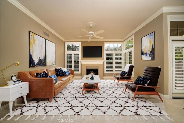 living room with crown molding and ceiling fan