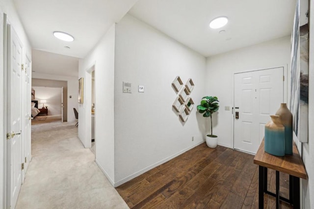 entryway with dark hardwood / wood-style floors