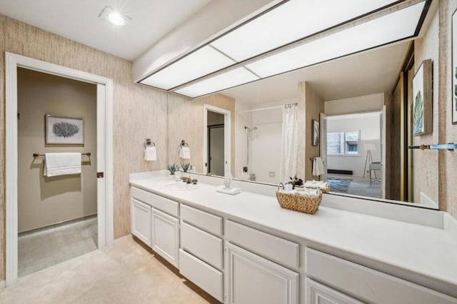 bathroom with vanity and curtained shower