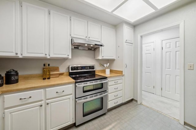 kitchen with white cabinetry and double oven range