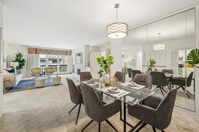 dining room featuring light carpet