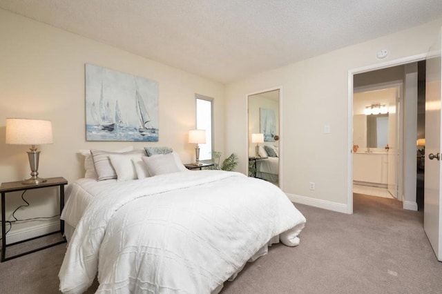 bedroom featuring carpet floors and a textured ceiling