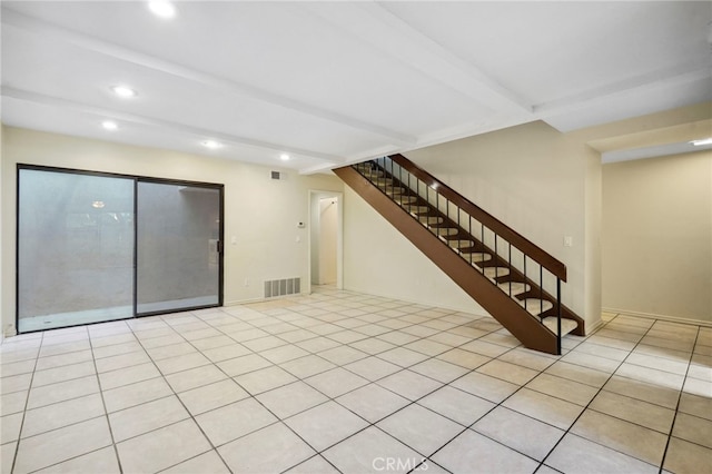 basement featuring light tile patterned flooring