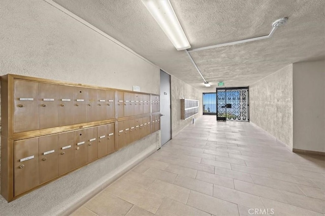 hallway featuring a mail area