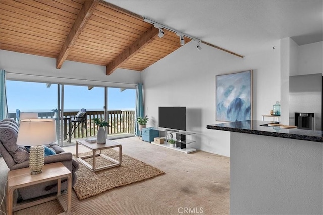 living room with track lighting, wooden ceiling, carpet, and vaulted ceiling with beams