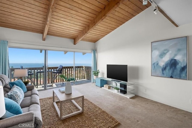 carpeted living room with vaulted ceiling with beams, wooden ceiling, a healthy amount of sunlight, and a water view