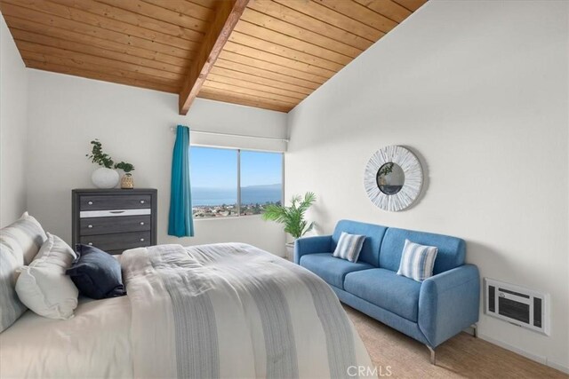 bedroom with heating unit, vaulted ceiling with beams, wood ceiling, and carpet