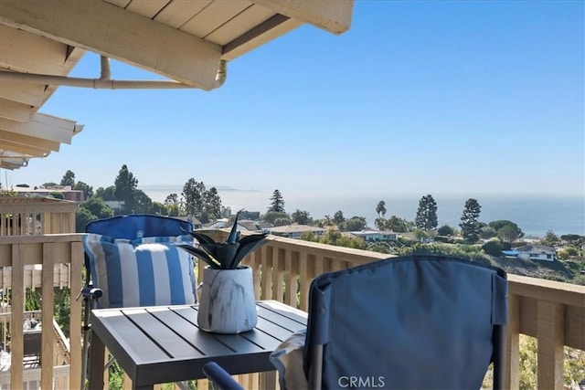 balcony featuring a water view