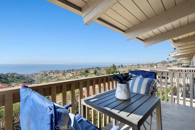 balcony featuring a water view