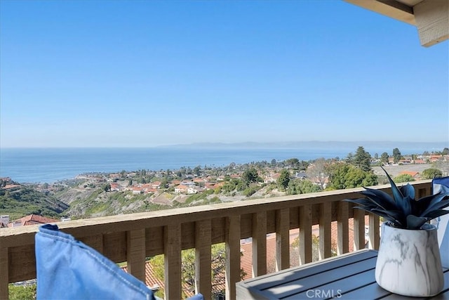 balcony featuring a water view