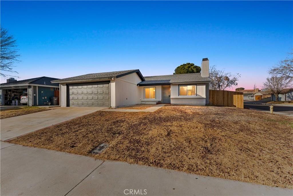 ranch-style home with a garage