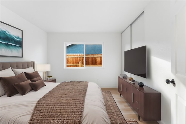 bedroom with light wood-type flooring