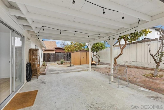 view of patio featuring a storage unit