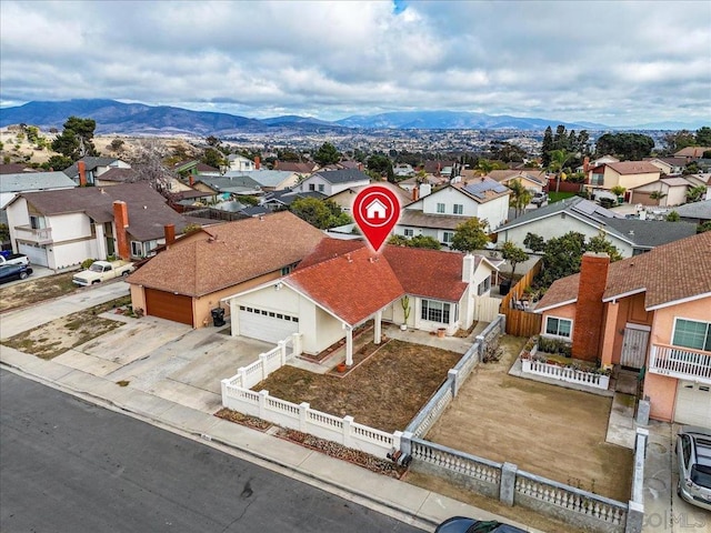 drone / aerial view featuring a mountain view