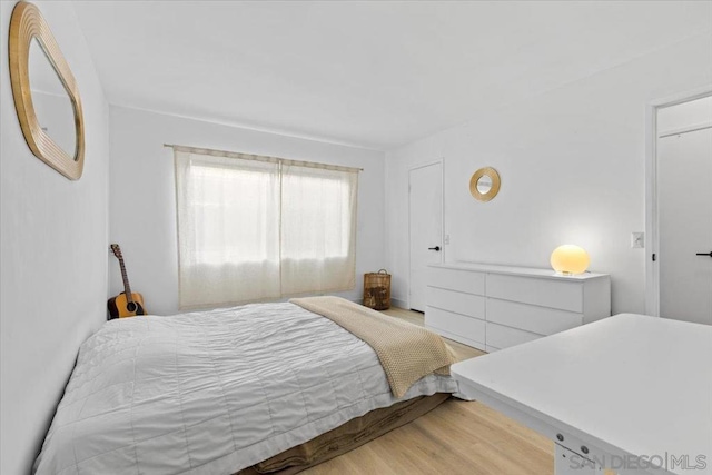 bedroom with light hardwood / wood-style floors