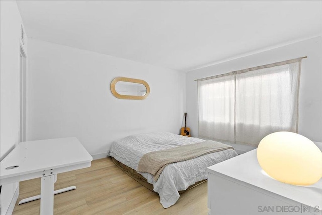 bedroom featuring light wood-type flooring