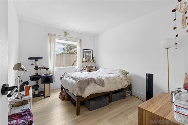 bedroom with light wood-type flooring