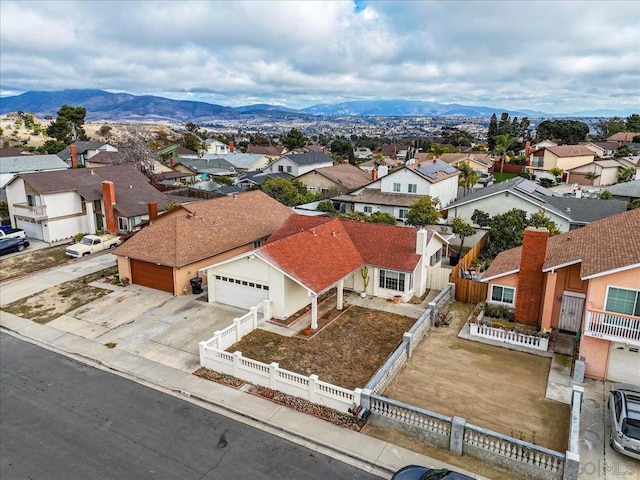 birds eye view of property featuring a mountain view