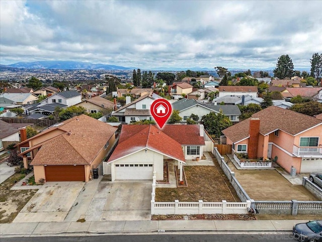 birds eye view of property featuring a mountain view