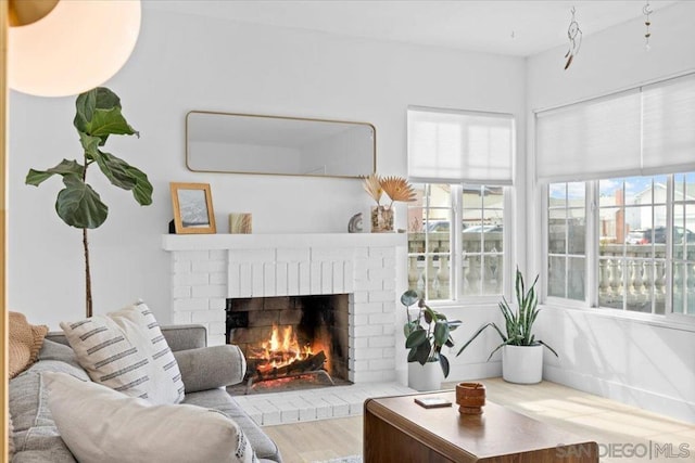 living room featuring hardwood / wood-style flooring and a fireplace