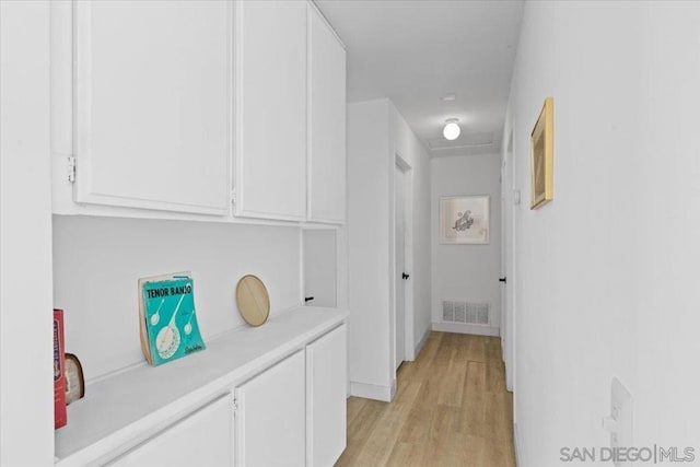 hallway with light wood-type flooring