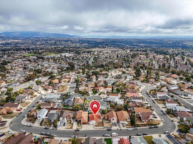 drone / aerial view featuring a mountain view