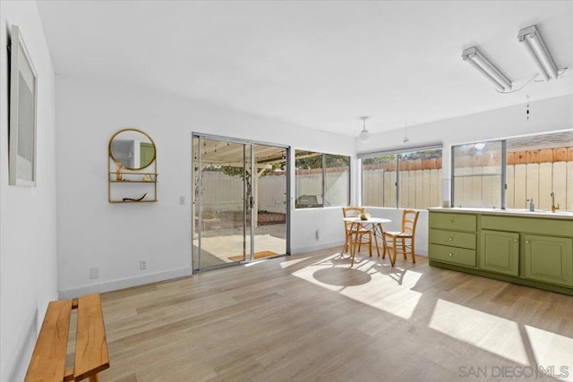 sunroom featuring sink