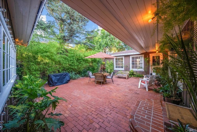 view of patio / terrace with outdoor dining area and a grill